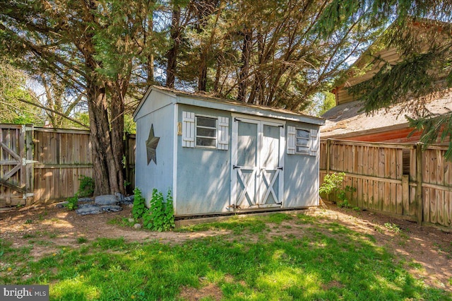 view of shed featuring a fenced backyard