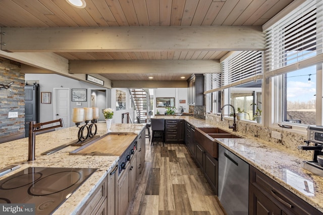 kitchen with stainless steel dishwasher, wooden ceiling, black electric stovetop, and a sink