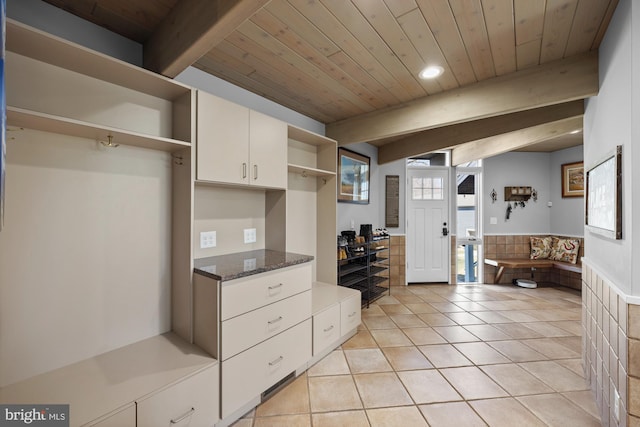 kitchen featuring beamed ceiling, light tile patterned floors, wooden ceiling, white cabinets, and open shelves