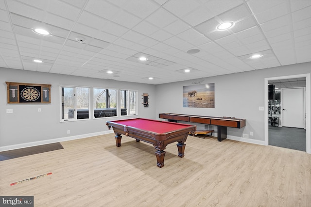 recreation room with billiards, wood finished floors, baseboards, and a drop ceiling