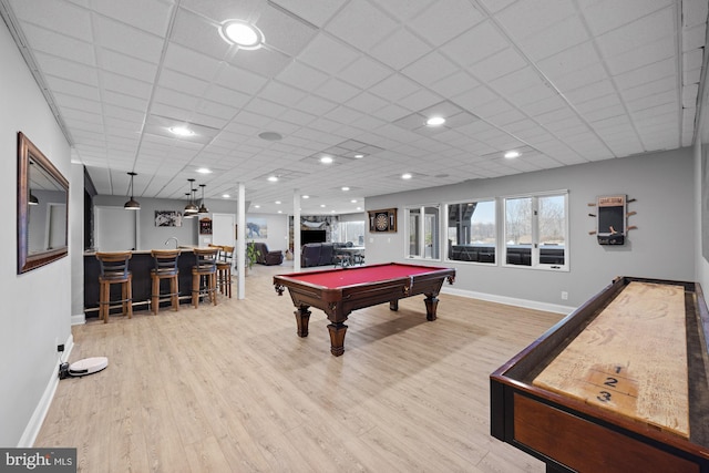 game room with baseboards, bar, wood finished floors, and billiards