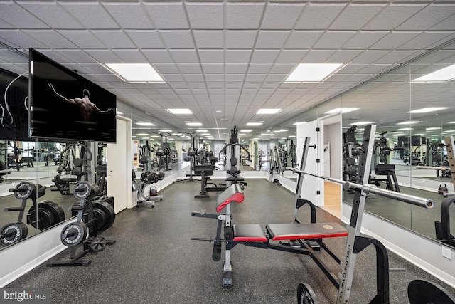 workout area featuring a paneled ceiling