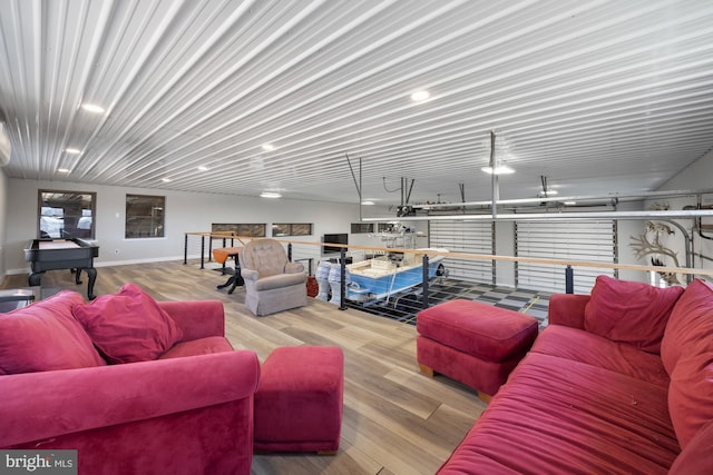 living room with wood finished floors and baseboards