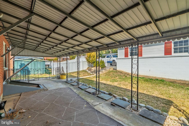 exterior space featuring a gate and fence