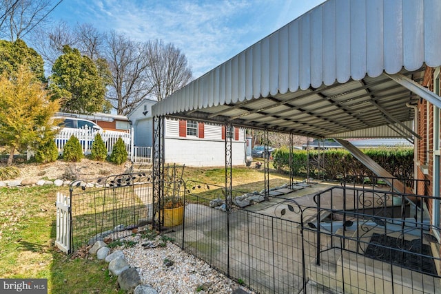 exterior space with a garage and fence