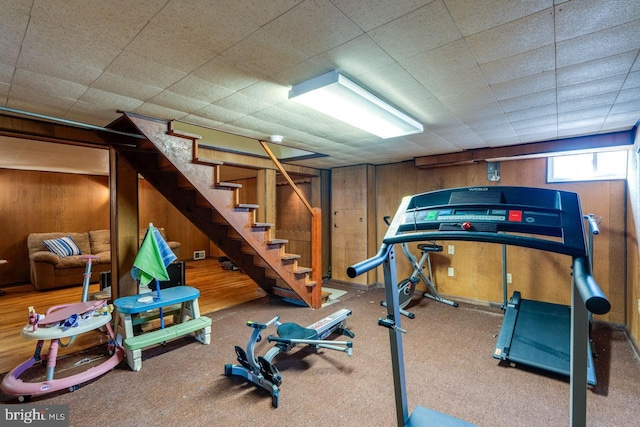 exercise area featuring wooden walls