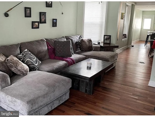 living room with wood finished floors and baseboards