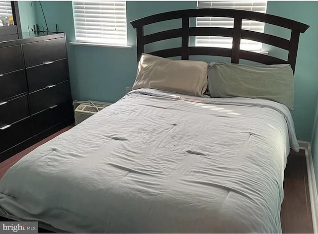 bedroom with wood finished floors