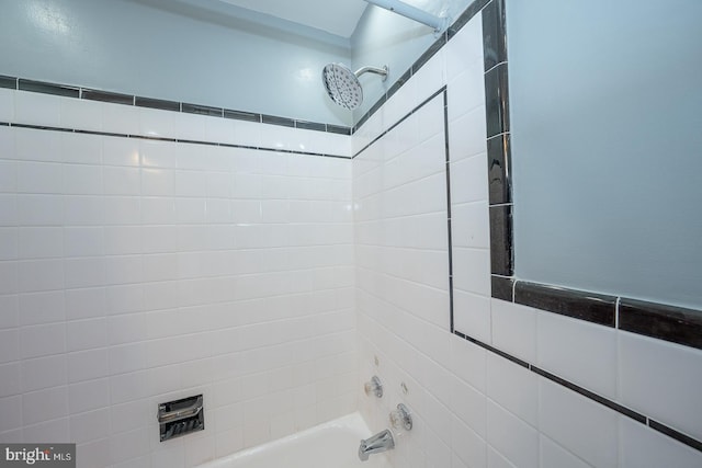 bathroom with shower / washtub combination