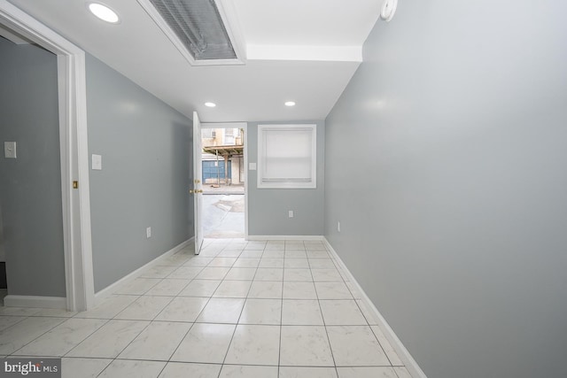 empty room featuring recessed lighting, baseboards, visible vents, and light tile patterned floors