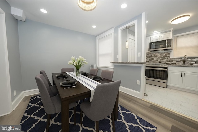 510 Woodcliffe Rd, Upper Darby, PA 19082 - dining area with light wood-type flooring, recessed lighting, and radiator heating unit