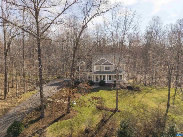 3535 Foxwood Dr, Barboursville, VA 22923 - view of front of home with a porch, a view of trees, driveway, and a front lawn