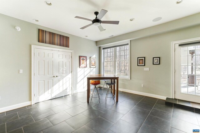 3535 Foxwood Dr, Barboursville, VA 22923 - unfurnished dining area featuring plenty of natural light, baseboards, ceiling fan, and dark tile patterned flooring