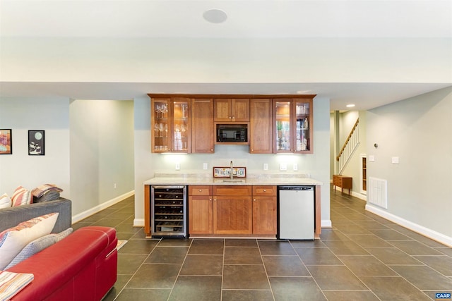 3535 Foxwood Dr, Barboursville, VA 22923 - kitchen with brown cabinetry, dishwasher, beverage cooler, and black microwave