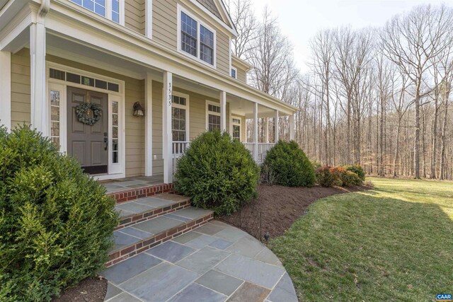 3535 Foxwood Dr, Barboursville, VA 22923 - view of exterior entry featuring a lawn and a porch