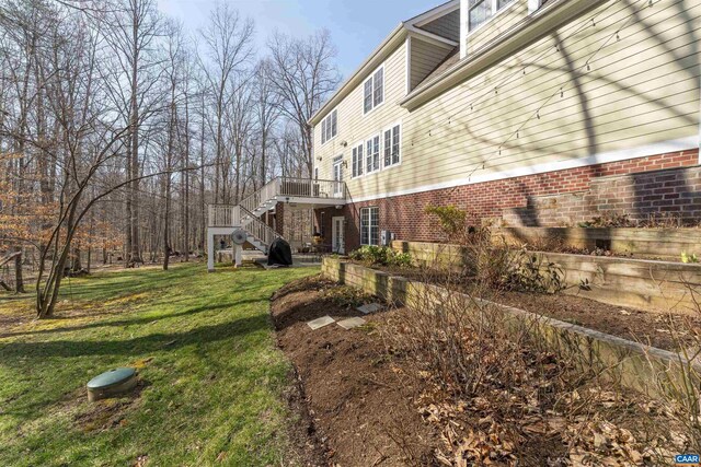 3535 Foxwood Dr, Barboursville, VA 22923 - view of side of property featuring brick siding, stairs, and a yard