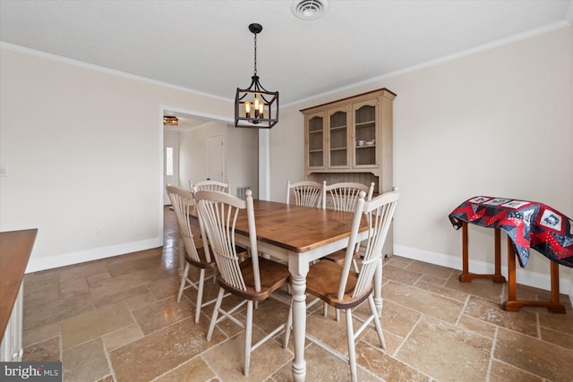 dining area featuring visible vents, baseboards, a notable chandelier, and stone tile floors