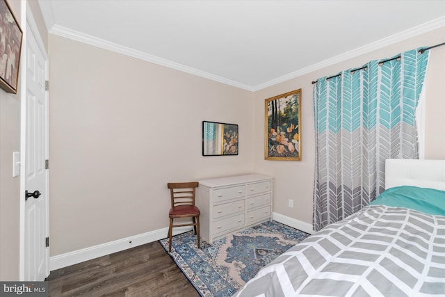 bedroom featuring wood finished floors, baseboards, and ornamental molding