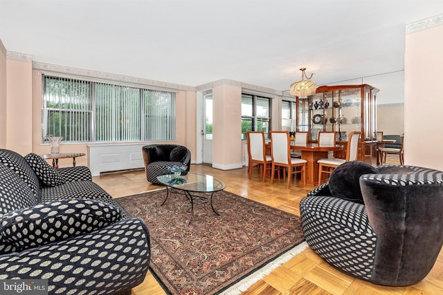 living area featuring a notable chandelier