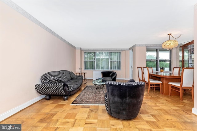 living room featuring baseboards and plenty of natural light