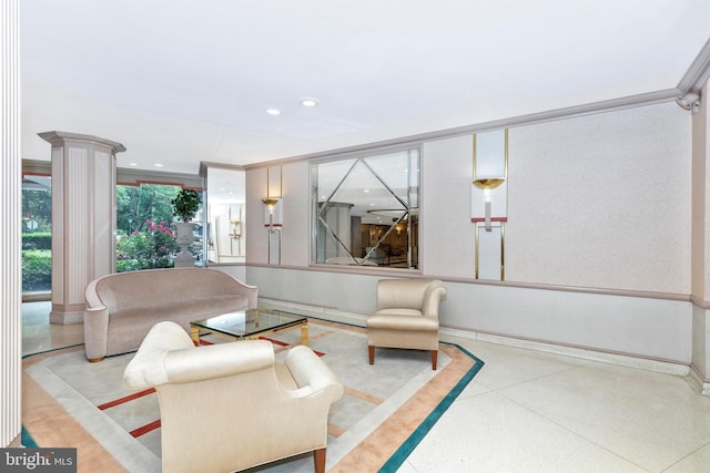 living area with crown molding, recessed lighting, speckled floor, and baseboards