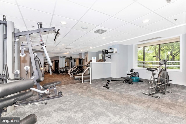 exercise room featuring recessed lighting, visible vents, a paneled ceiling, and carpet flooring