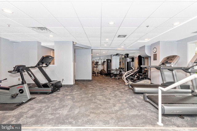 exercise room with visible vents, carpet, and a drop ceiling