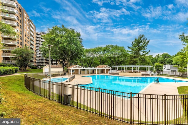 community pool featuring a yard, a pergola, a patio, and fence