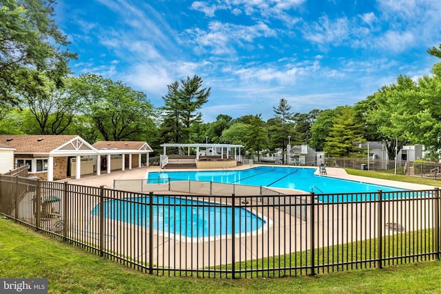 community pool featuring a patio, fence, and a pergola