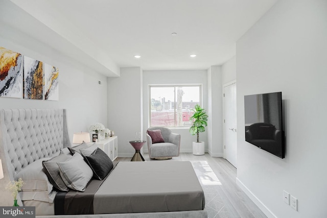 bedroom featuring recessed lighting, wood finished floors, and baseboards