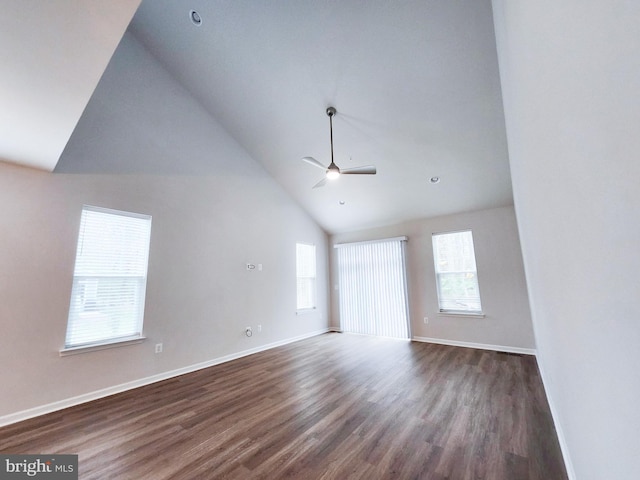 unfurnished room featuring dark wood-style floors, a ceiling fan, baseboards, and high vaulted ceiling