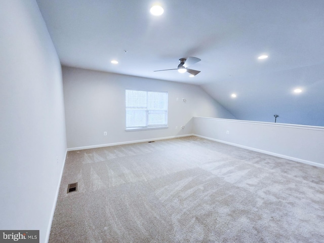 bonus room featuring visible vents, baseboards, ceiling fan, vaulted ceiling, and carpet floors