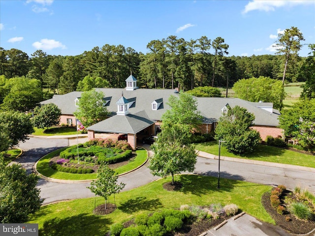 birds eye view of property with a forest view