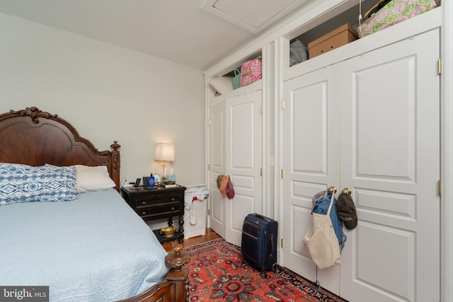 bedroom featuring wood finished floors