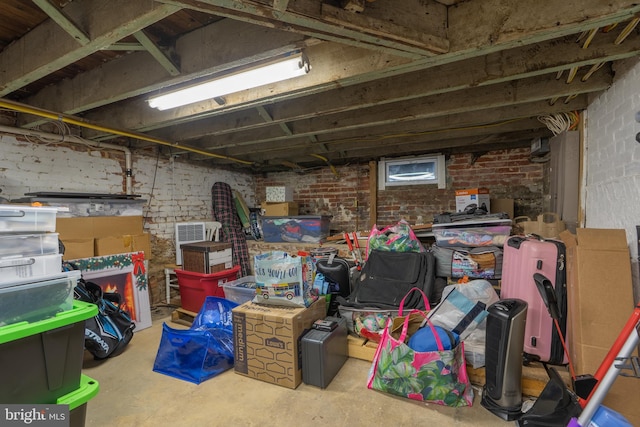 unfinished basement with brick wall