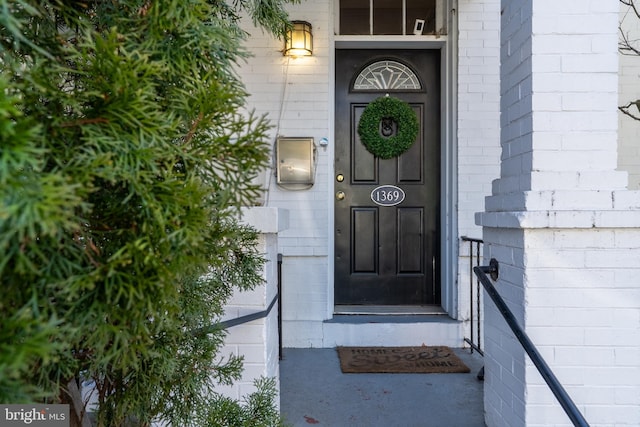 entrance to property with concrete block siding