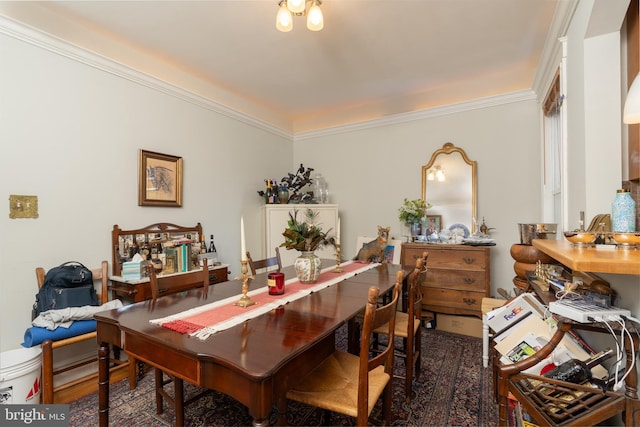 dining area featuring ornamental molding