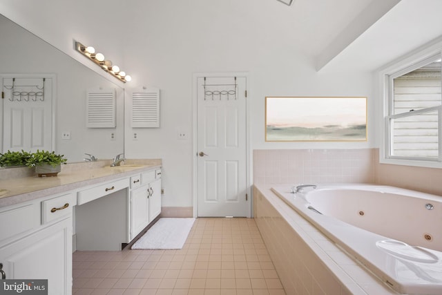 bathroom with lofted ceiling, tile patterned flooring, double vanity, a jetted tub, and a sink
