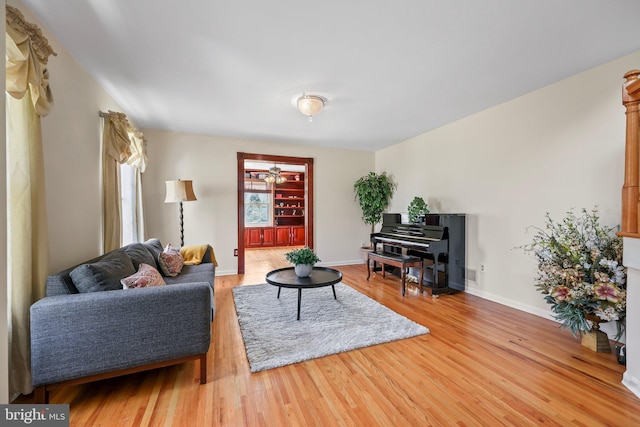 living room featuring wood finished floors and baseboards