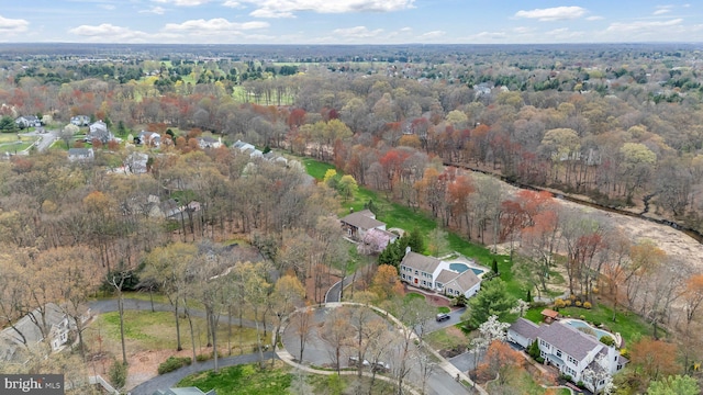 drone / aerial view featuring a view of trees