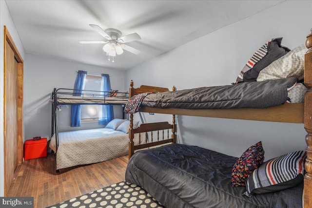 bedroom featuring a ceiling fan and wood finished floors