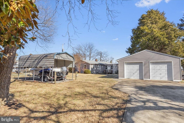 view of yard with a garage and an outdoor structure