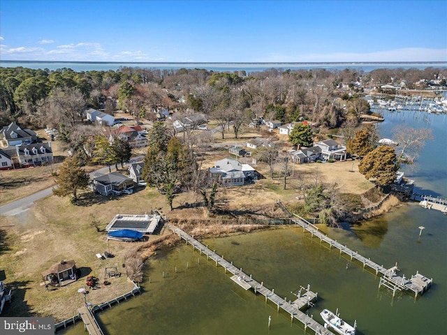 birds eye view of property with a water view