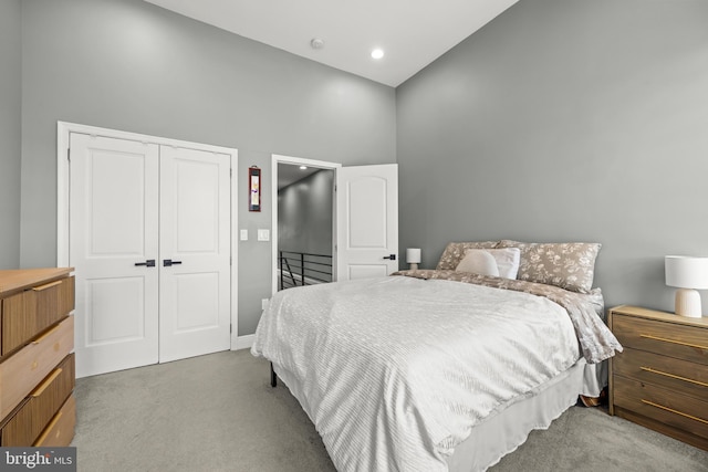 carpeted bedroom with a closet