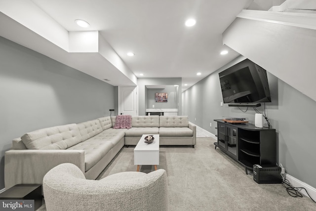 living area with light carpet, recessed lighting, baseboards, and bar