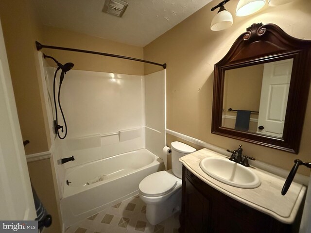 bathroom featuring vanity, bathtub / shower combination, toilet, and visible vents