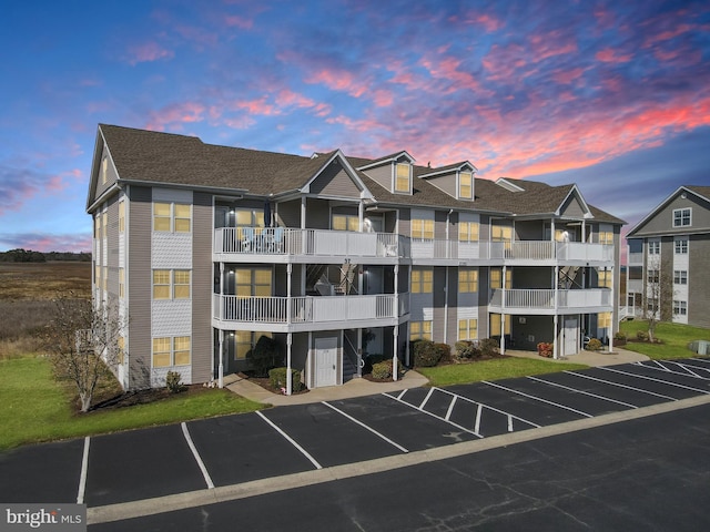 view of building exterior featuring uncovered parking