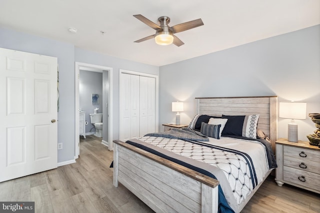 bedroom with ceiling fan, baseboards, a closet, and light wood-type flooring