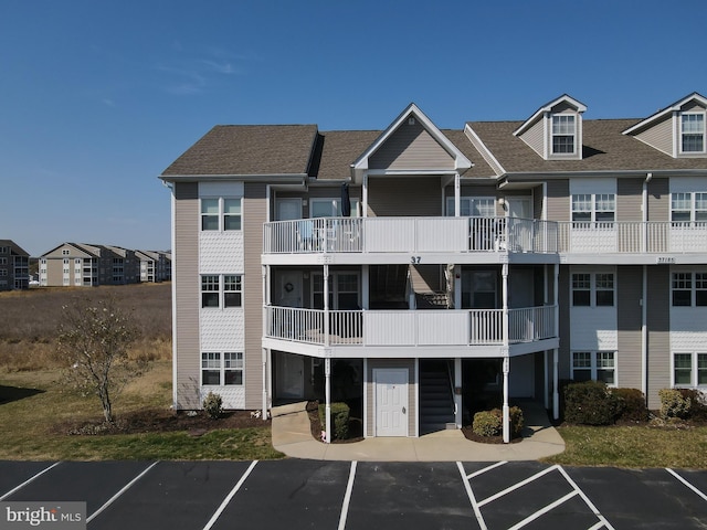 view of property with uncovered parking