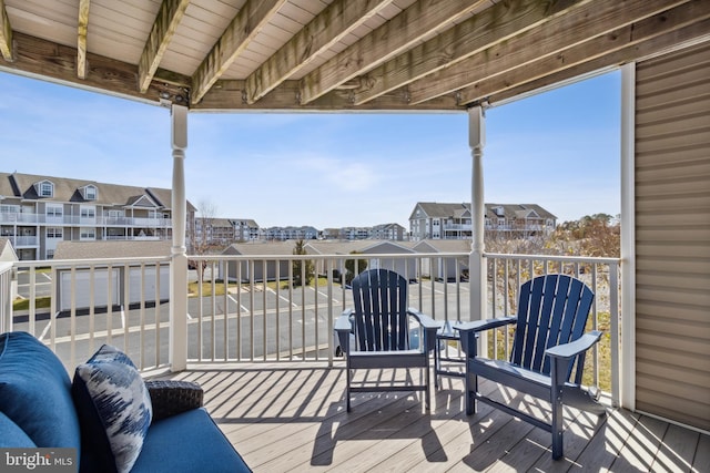 wooden deck with a residential view